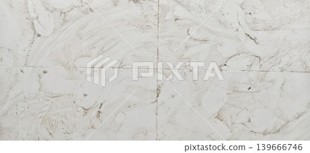 Dirty white ceramic floor with stains and footprints Dirty white ceramic floor with stains and footprints 139666746