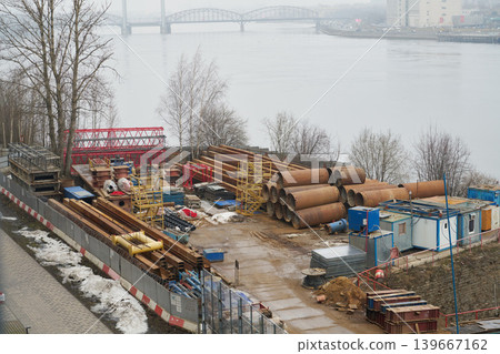 Riverbank staging showcasing assembly components and atmospheric conditions Riverbank staging showcasing assembly components and atmospheric conditions 139667162