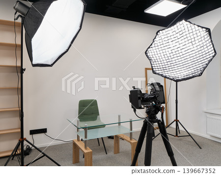 Camera on tripod with lighting equipment prepared for recording Camera on tripod with lighting equipment prepared for recording 139667352
