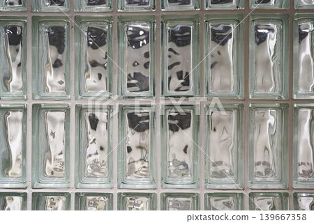 Translucent glass block wall, muted industrial aesthetic Translucent glass block wall, muted industrial aesthetic 139667358