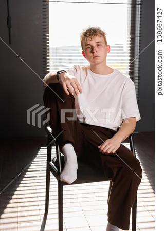 Tranquil male figure practicing meditation in peaceful environment Tranquil male figure practicing meditation in peaceful environment 139667427