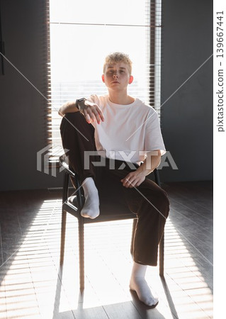 Male person relishing sunshine inside comfortable residence 139667441