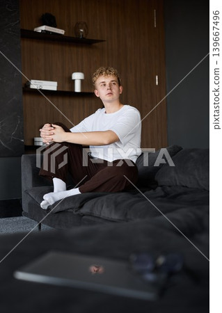 Youthful individual concentrates on work in cozy setting Youthful individual concentrates on work in cozy setting 139667496