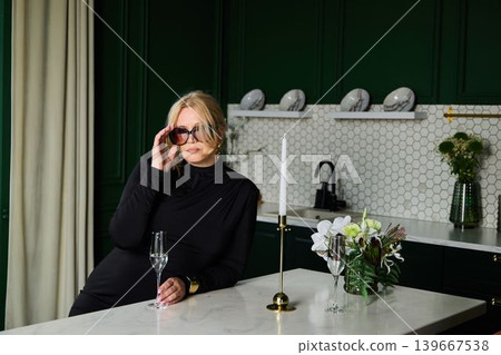 White woman entrepreneur unwinding with champagne after work White woman entrepreneur unwinding with champagne after work 139667538