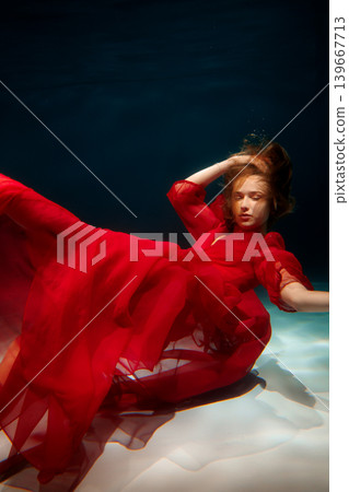 Enigmatic water nymph with flowing fabric and peaceful gaze Enigmatic water nymph with flowing fabric and peaceful gaze 139667713