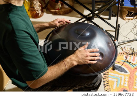 Closeup of hands creating ambient sound with equipment and lighting Closeup of hands creating ambient sound with equipment and lighting 139667728