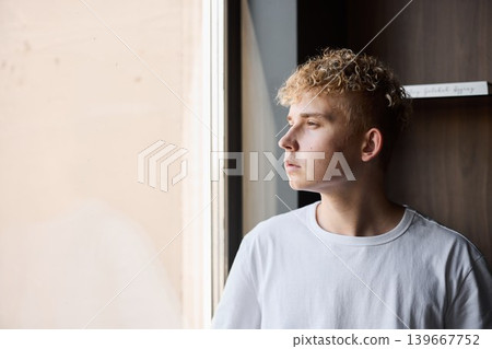 Young male artist depicted with introspective focus on songwriting session Young male artist depicted with introspective focus on songwriting session 139667752