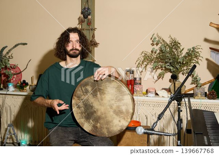 Person demonstrates percussion technique before engaged small group Person demonstrates percussion technique before engaged small group 139667768