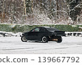 Sportscar with sparks moves through frosted woodland environment 139667792