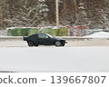 Automobile practitioner refines driving strategies on snowy race track 139667807