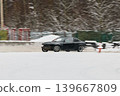 Engineers analyze vehicle behavior during winter handling tests 139667809