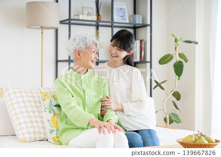 Parents and children relaxing in the living room 139667826