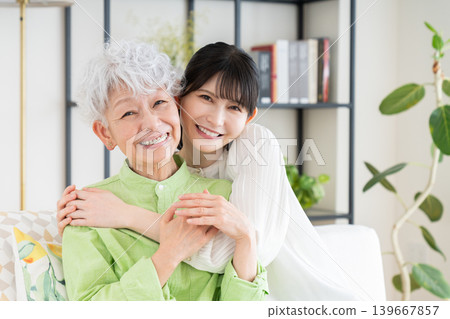 Parents and children relaxing in the living room Parents and children relaxing in the living room 139667857