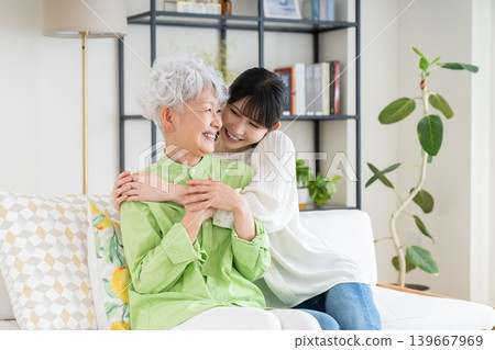 Parents and children relaxing in the living room Parents and children relaxing in the living room 139667969