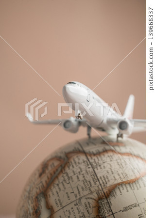 Airplane on globe close up, international travel tourism transportation and global destination concept Airplane on globe close up, international travel tourism transportation and global destination concept 139668337