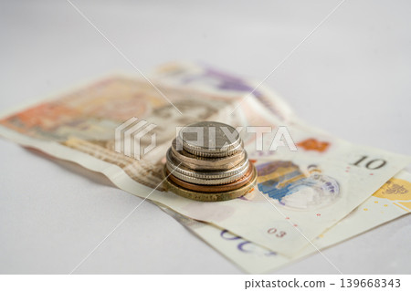 Cash money with coins and banknotes close up, personal finance savings budgeting and payment concept Cash money with coins and banknotes close up, personal finance savings budgeting and payment concept 139668343