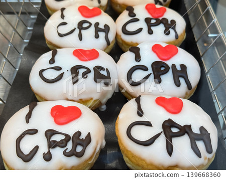 White Glazed Donuts with I Love Copenhagen Decoration. White Glazed Donuts with I Love Copenhagen Decoration. 139668360