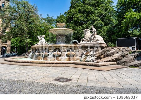 The Wittelsbacher fountain is a neoclassical monument located at Maximiliansplatz in the center of Munich, Bavaria, Germany. The Wittelsbacher fountain is a neoclassical monument located at Maximiliansplatz in the center of Munich, Bavaria, Germany. 139669037