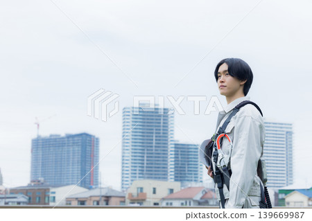 Workers wearing full body harnesses Workers wearing full body harnesses 139669987