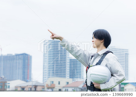 Workers wearing full body harnesses Workers wearing full body harnesses 139669990