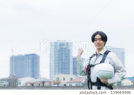 Workers wearing full body harnesses Workers wearing full body harnesses 139669996