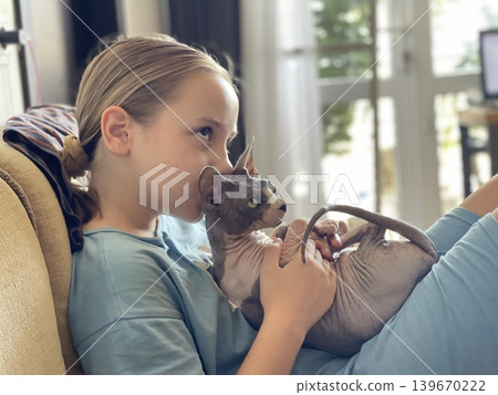 Cheerful young girl hugging cat pet at home 139670222