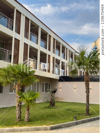 Modern Hotel Building Palm Trees Green Lawn Modern Hotel Building Palm Trees Green Lawn 139670404