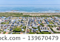 Drone aerial photography of a coastal residential area and the Pacific Ocean in Ichinomiya Town, Chiba Prefecture. 139670479