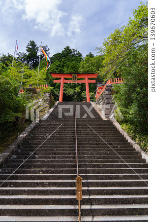The vermilion torii gate and long stone steps of Kumano Nachi Taisha Shrine in Nachikatsuura Town, Wakayama Prefecture The vermilion torii gate and long stone steps of Kumano Nachi Taisha Shrine in Nachikatsuura Town, Wakayama Prefecture 139670603