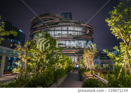 Exterior view of MoN Takanawa (Cultural Creation Building) and night view of the lush pedestrian deck [Minato Ward, Tokyo] 139671234