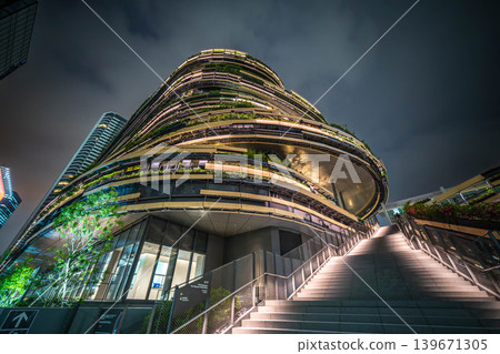 Exterior view of MoN Takanawa (Cultural Creation Building) and a night view looking up at the grand staircase [Minato Ward, Tokyo] 139671305