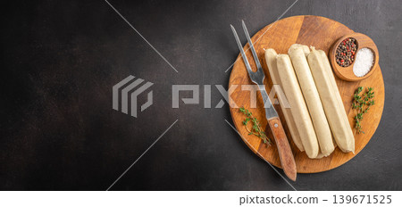 White sausages on wooden board with spices White sausages on wooden board with spices 139671525
