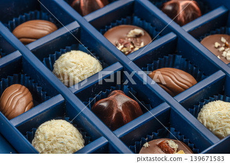 Chocolate pralines assortment in luxury candy box close up background texture 139671583