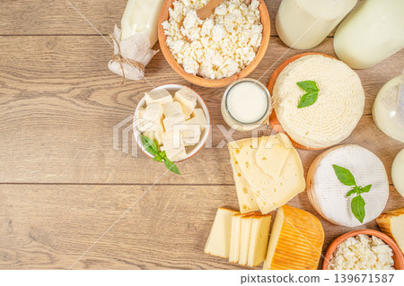 Cheese assortment and dairy products on wooden table top view background 139671587