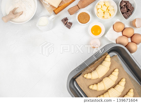 Croissant dough preparation with baking ingredients on white background, top view flat lay 139671604