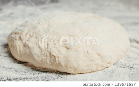 Fresh raw yeast dough on floured table background with copy space for bakery recipe and homemade bread concept 139671657