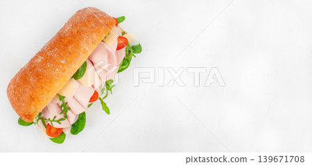 Turkey ham sandwich with cheese and greens on white background with copy space 139671708