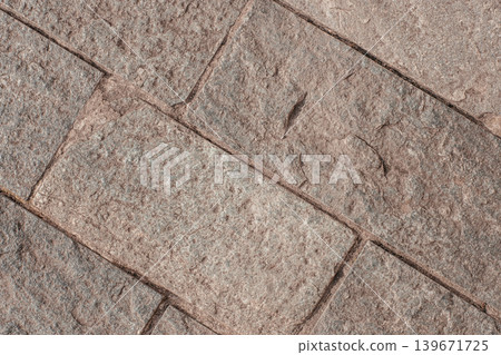 Stone pavement texture background with rough geometric tile pattern Stone pavement texture background with rough geometric tile pattern 139671725