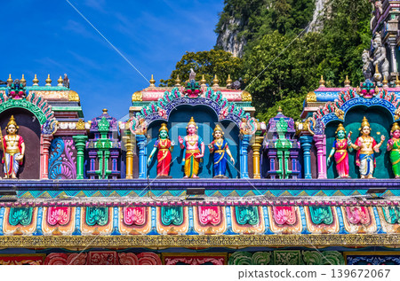 Colorful Hindu Deity Statues on Temple Facade at Batu Caves in Kuala Lumpur, Malaysia Colorful Hindu Deity Statues on Temple Facade at Batu Caves in Kuala Lumpur, Malaysia 139672067