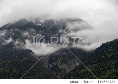 Dramatic Misty Mountain with Low Clouds in the Bavarian Alps Dramatic Misty Mountain with Low Clouds in the Bavarian Alps 139672128