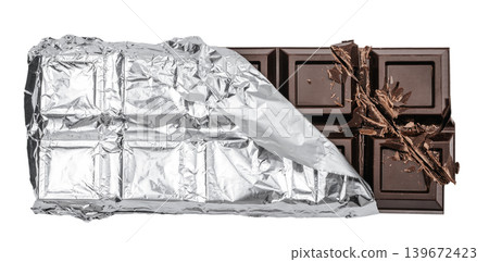 Dark chocolate bar in silver foil wrapper isolated on white background, top view flat lay Dark chocolate bar in silver foil wrapper isolated on white background, top view flat lay 139672423