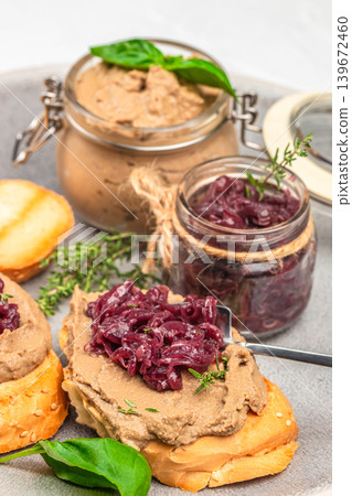 Liver pate with onion jam on toasted bread close up gourmet appetizer composition Liver pate with onion jam on toasted bread close up gourmet appetizer composition 139672460