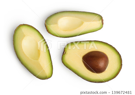 avocado half and slices isolated on white background close up avocado half and slices isolated on white background close up 139672481