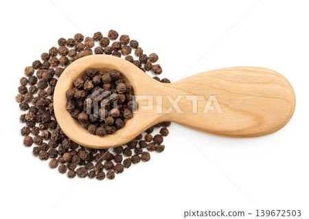 Black peppercorns or pepper in a wooden spoon isolated on a white background. Top view. Flat lay Black peppercorns or pepper in a wooden spoon isolated on a white background. Top view. Flat lay 139672503