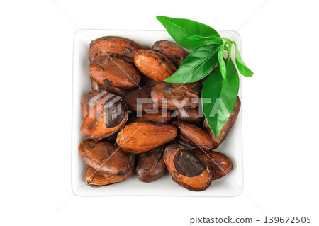 cocoa beans in ceramic bowl isolated on white background. Top view. Flat lay 139672505