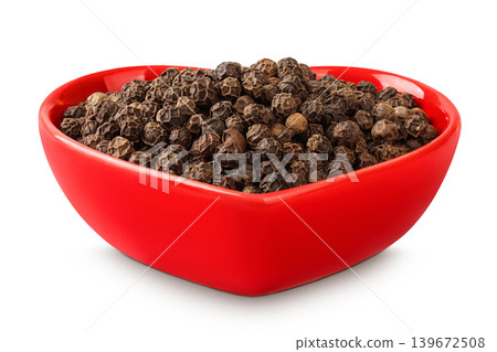 Black peppercorns or pepper in a ceramic bowl isolated on a white background Black peppercorns or pepper in a ceramic bowl isolated on a white background 139672508