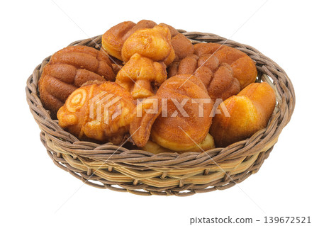 cookies of different shapes in a wicker basket isolated on a white background cookies of different shapes in a wicker basket isolated on a white background 139672521