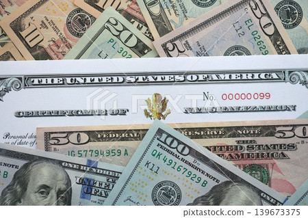 US Certificate of Naturalization on big amount of money bills US Certificate of Naturalization on big amount of money bills 139673375