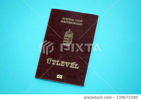 Hungarian passport book on light blue paper background close up. Travel document Hungarian passport book on light blue paper background close up. Travel document 139673390