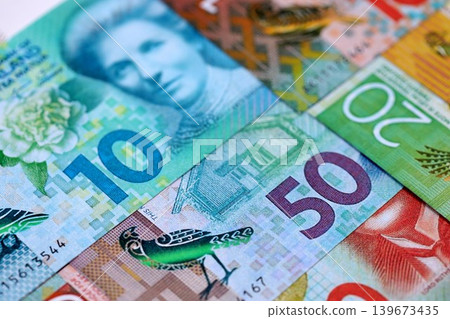 New Zealand dollar money bills in big amount on table close up. Rich life concept in New Zealand New Zealand dollar money bills in big amount on table close up. Rich life concept in New Zealand 139673435